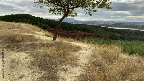 POV walk on trail along the hill in autumn. Outskirts of the city Simferopol