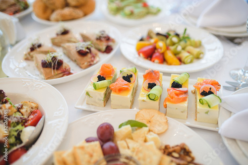 slices of cake with red fish