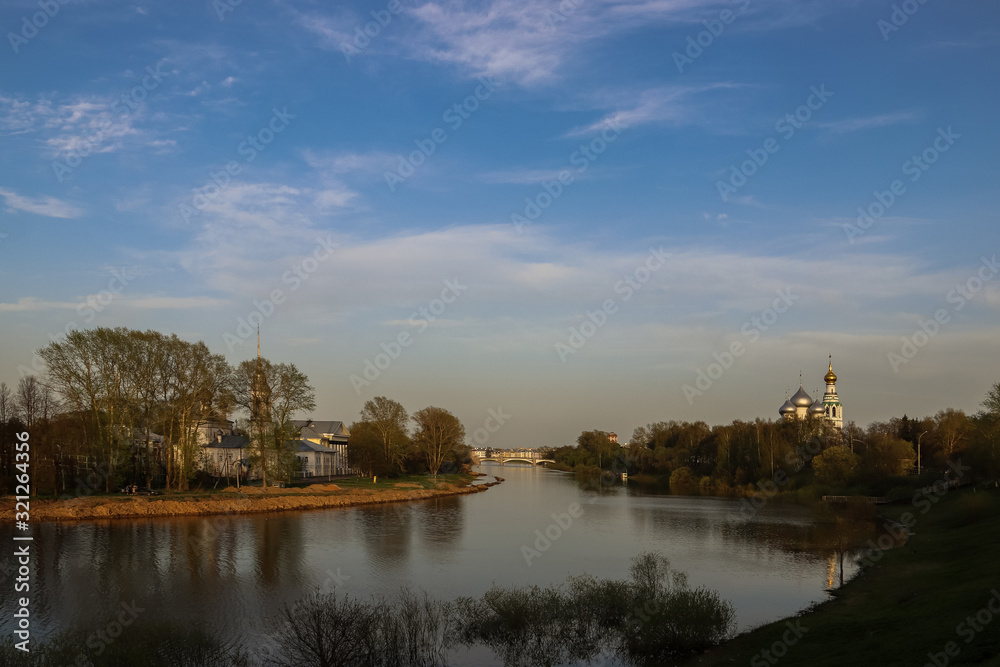 Vologda. Beautiful spring evening on the Vologda river Bank. Church Of The Meeting Of The Lord. 18th century; St. Sophia Cathedral