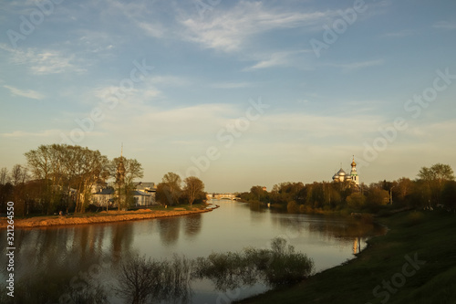 Vologda. Beautiful spring evening on the Vologda river Bank. Church Of The Meeting Of The Lord. 18th century; St. Sophia Cathedral