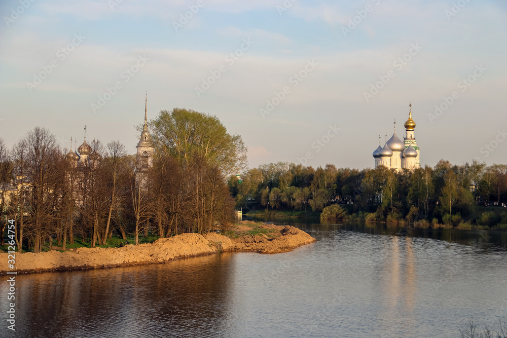 Fototapeta premium Vologda. Beautiful spring evening on the Vologda river Bank. Church Of The Meeting Of The Lord. 18th century; St. Sophia Cathedral
