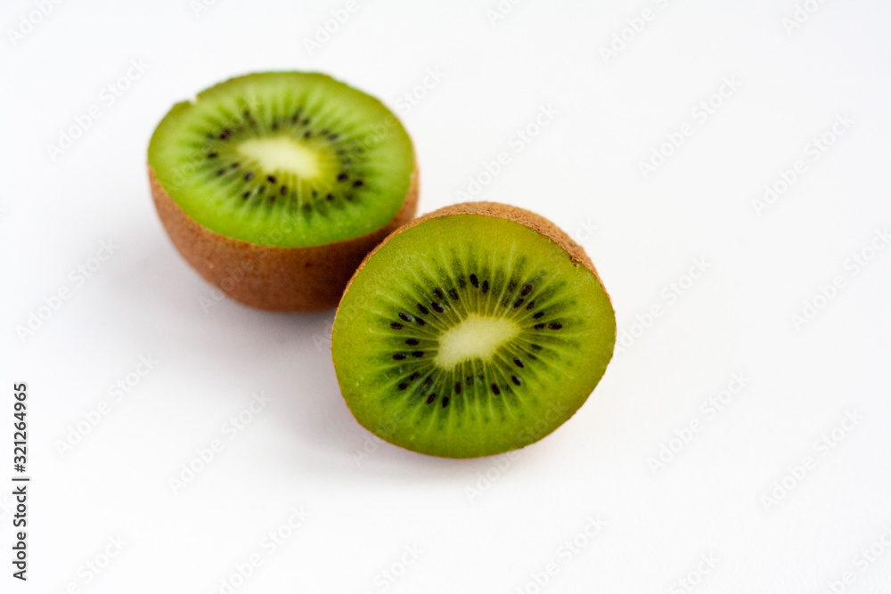Two kiwi halves isolated on white background Two kiwi halves isolated on white background
