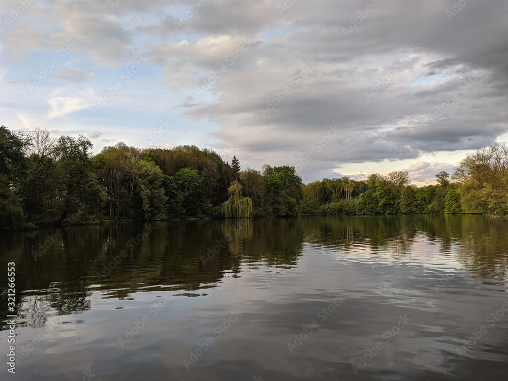 beautiful lake in a village near a pine forest beautiful lake in a village near a pine forest