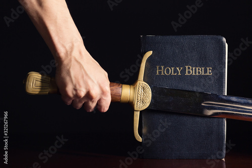 Young Athletic Man with His Bible and Sword