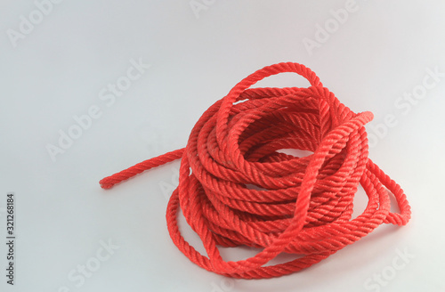 Konstfotografi Red nylon rope and white background
