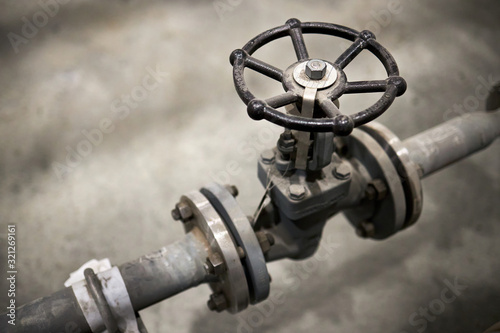 Close-up of industrial valve with focus on foreground ventil with copy space
