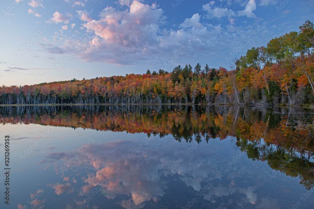 Autumn landscape of Scout Lake with mirrored reflections in calm water, Hiawatha National Forest, Michigan's Upper Peninsula, USA