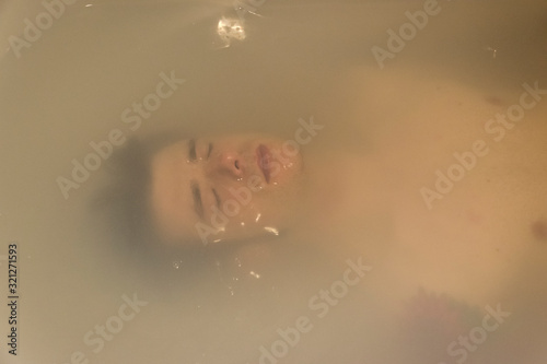 man relaxing on a bathtub