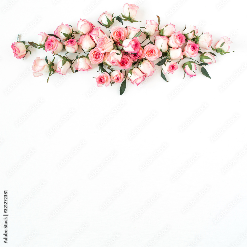 Floral composition with pink rose flower buds on white background. Flat lay, top view.