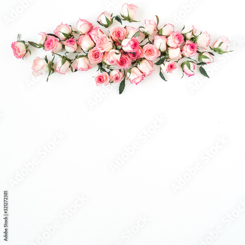 Floral composition with pink rose flower buds on white background. Flat lay, top view.