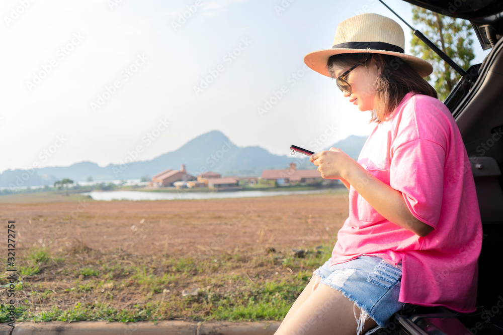 Asian woman using navigation or gps on mobile smartphone
