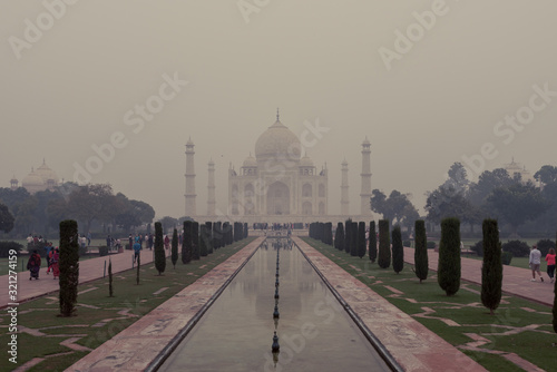 Front side of the Taj Mahal in Agra, India, on overcast morning with smog