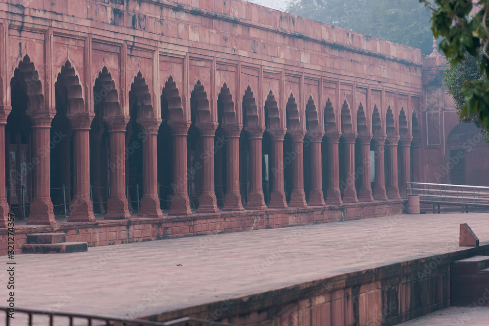 Row of columns inside the Taj Mahal made of red sandstone  in Agra, India
