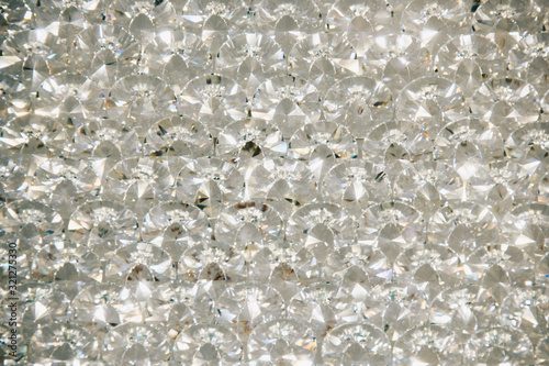 Beautiful shiny diamonds swarovski crystal background. Luxury, wealth. Cover pattern. Macro photo, close up of expensive stones.