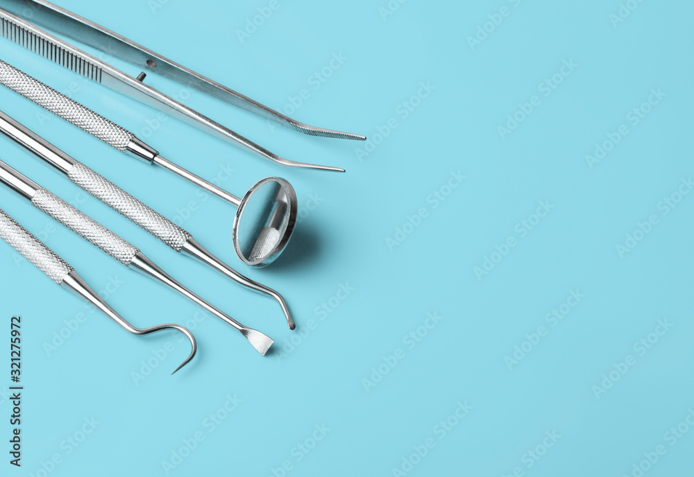 Fototapeta premium dental tools on blue background top view