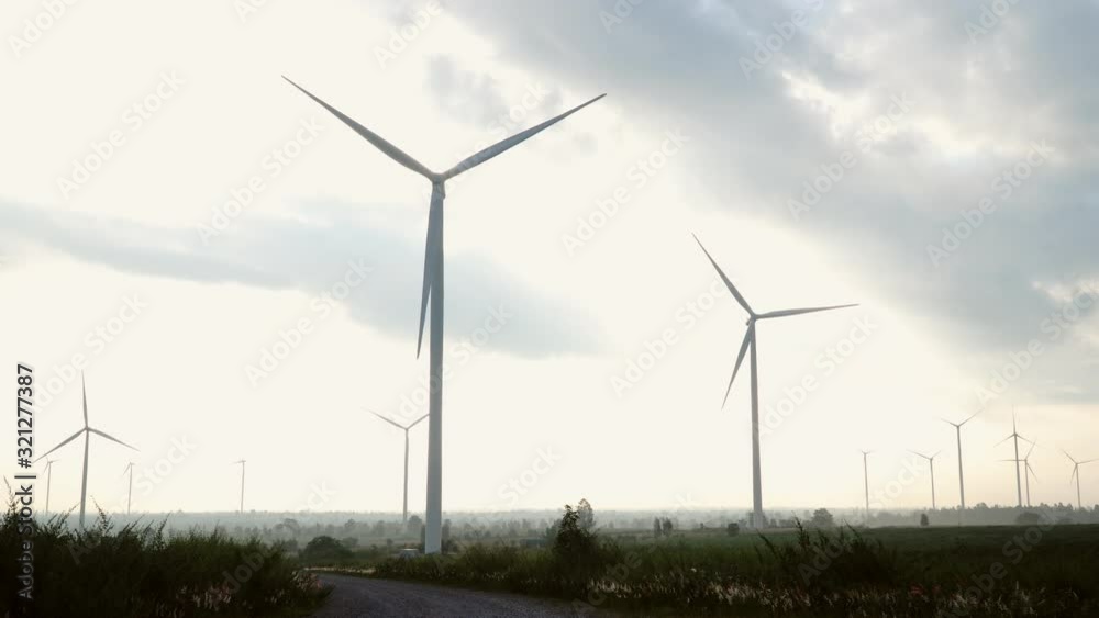 Wind turbine farm and agricultural fields on blue sky. Wind turbine farm and agricultural fields on blue sky.