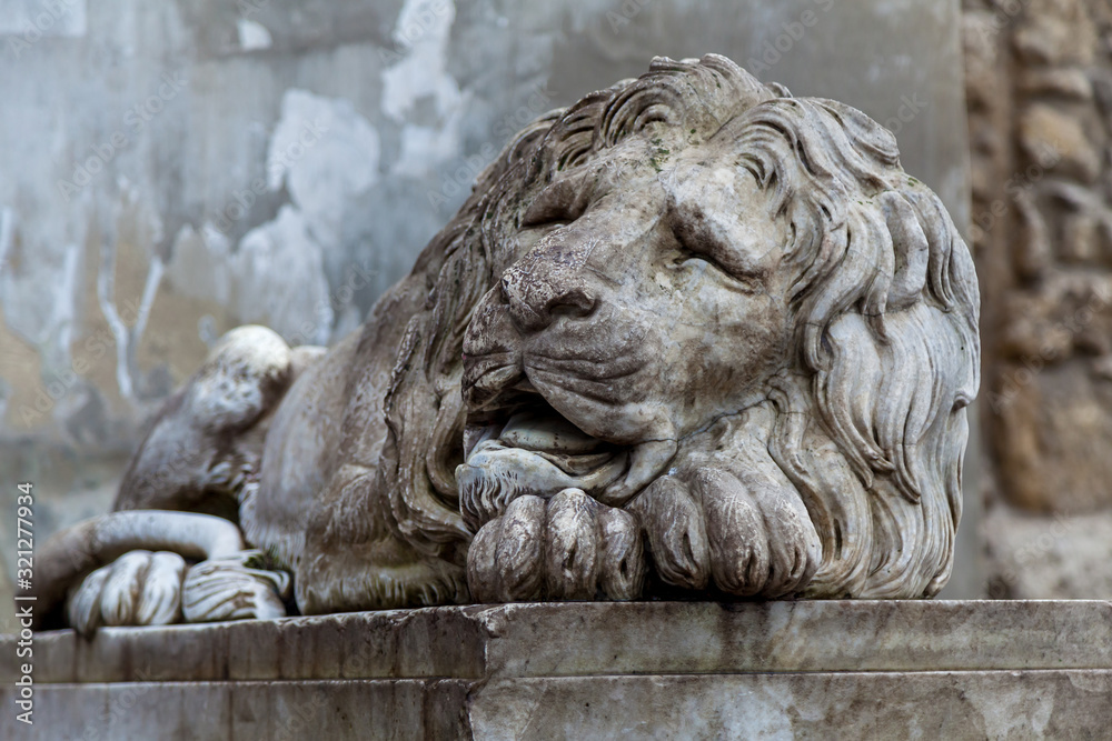 A stone sculpture of a lion