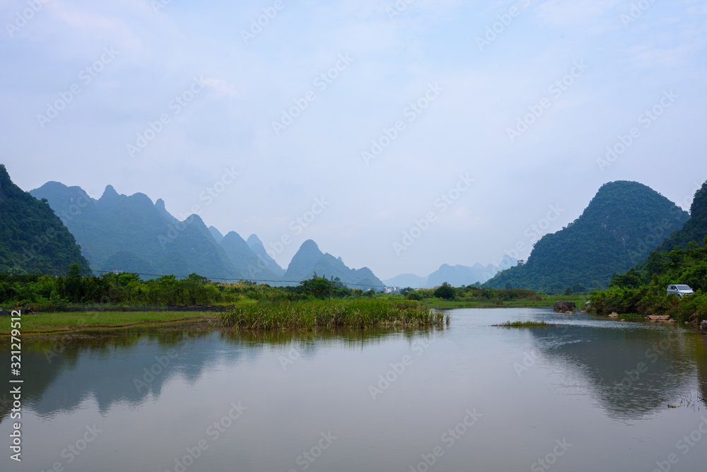 Beautiful karst mountains landscape and the Yulong river in Yangshuo County, Guilin, China