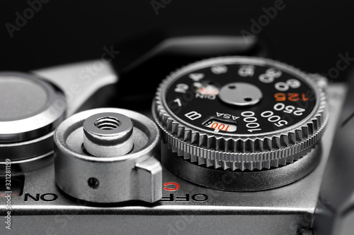 Shutter speed dial, shutter release button and film wind lever of old camera