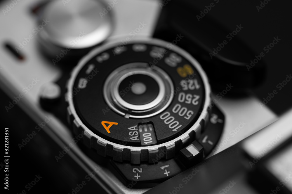 Shutter speed dial with exposure compensation values on a vintage film