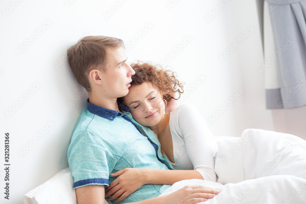 Romantic love couple make love scene on white bed Romantic love couple make love scene on white bed