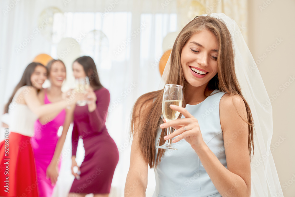 Bride with glass sitting on party in morning. Bride with glass sitting on party in morning.