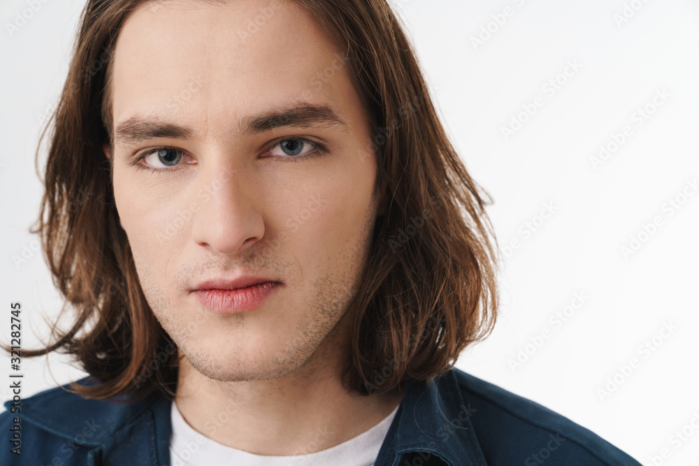 Image of attractive young man posing and looking at camera Image of attractive young man posing and looking at camera