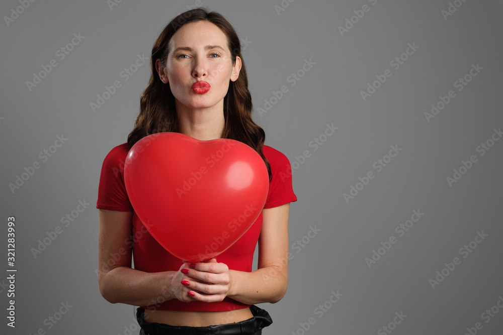 Beautyful emotional brunette girl with red balloon Beautyful emotional brunette girl with red balloon