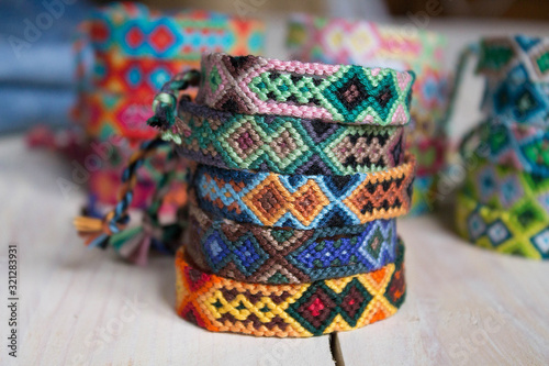 close-up isolated lots of colorful variety bracelets of handmade