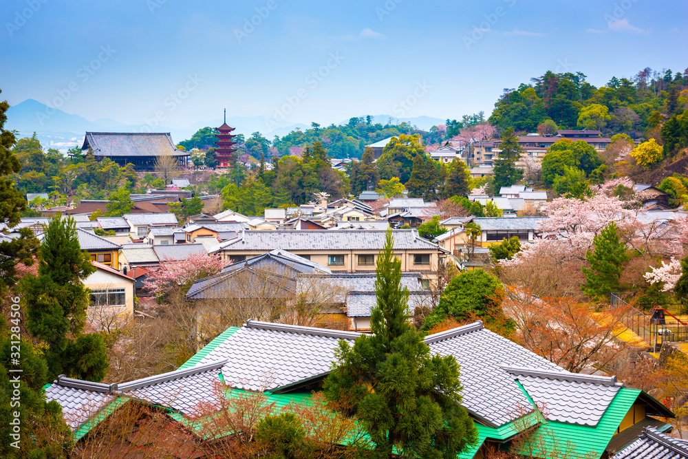 Fototapeta premium Miyajima, Hiroshima, Japan townscape at dusk.