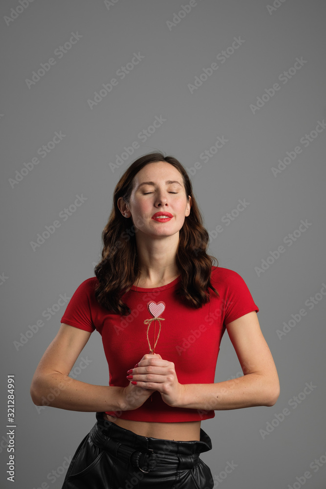 Beautyful emotional brunette girl with red balloon Beautyful emotional brunette girl with red balloon