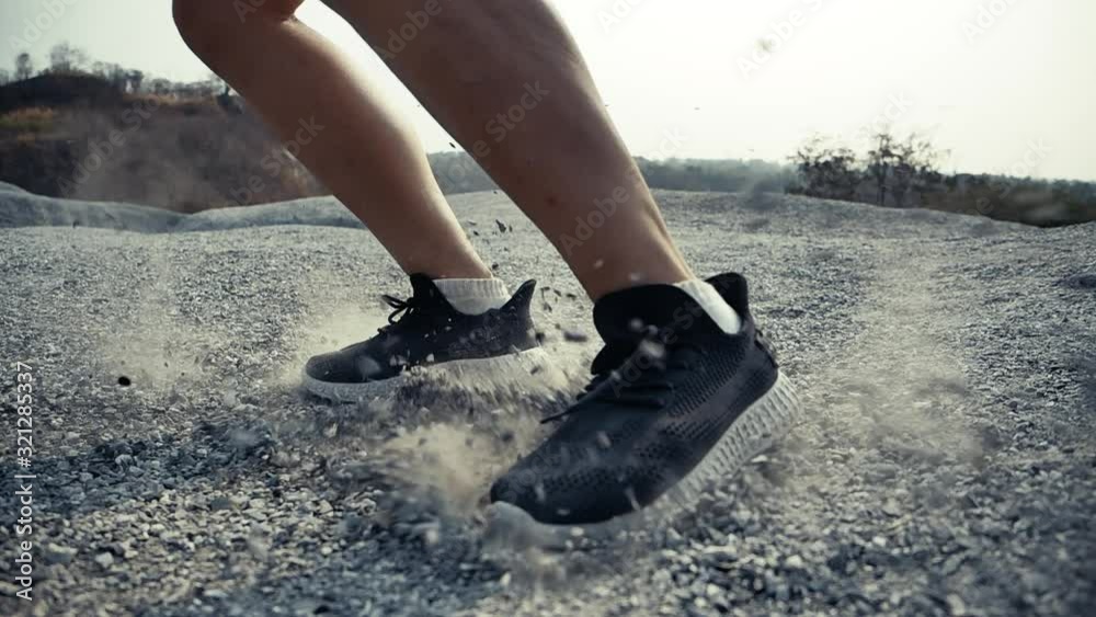 SLOW MOTION TIME WARP, Close up Trail Running in the rock mountain slide brake Rubble drop bounce off, Runners professional outdoor at beautiful nature difficult and challenging healthy lifestyle