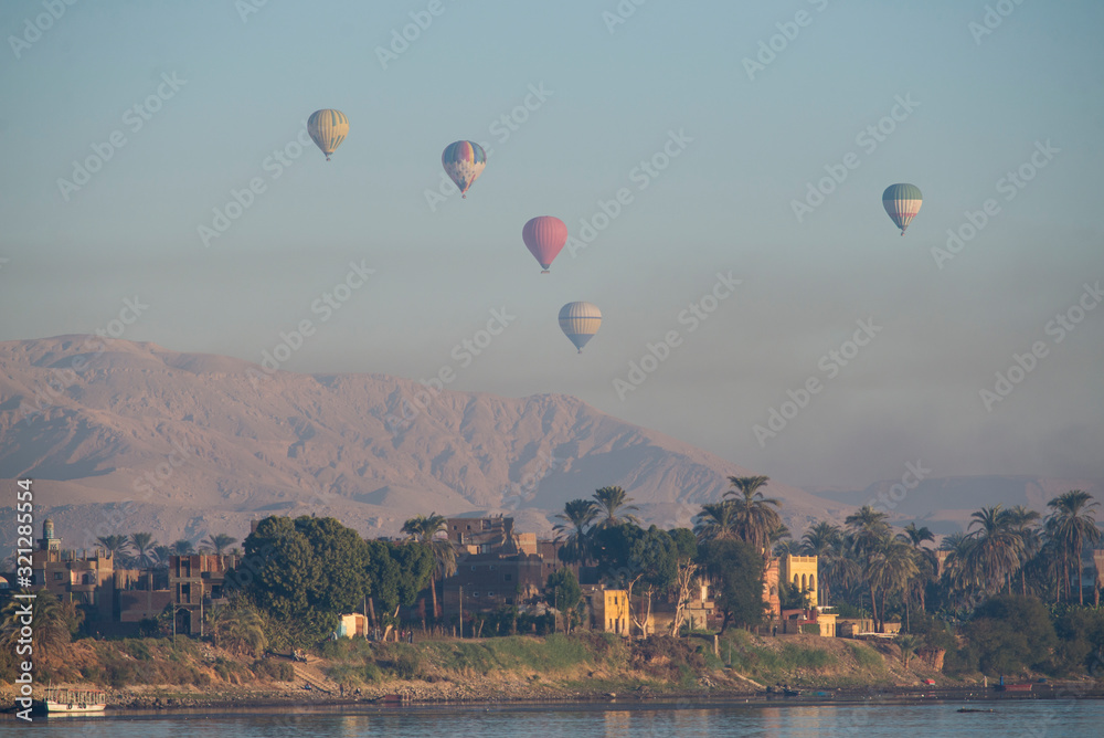 Naklejka premium View of river nile in Egypt showing Luxor west bank with hot air balloons
