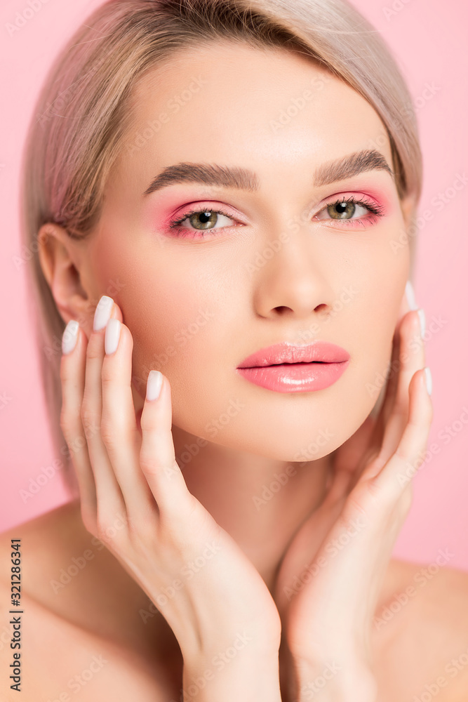 attractive tender woman with perfect skin, isolated on pink