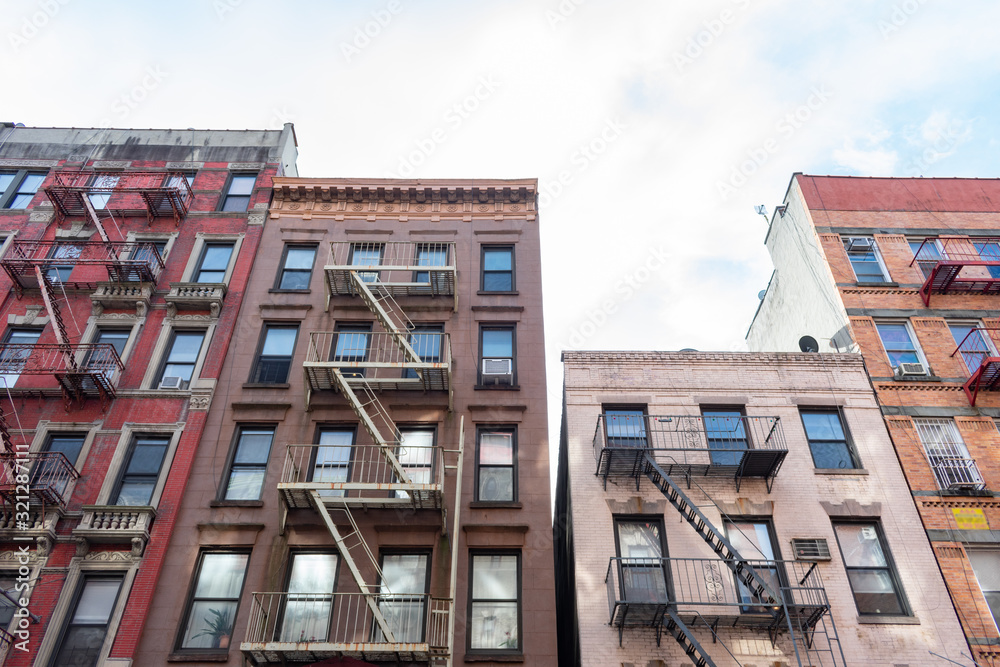 Colorful Old Buildings in Chinatown New York with Fire Escapes