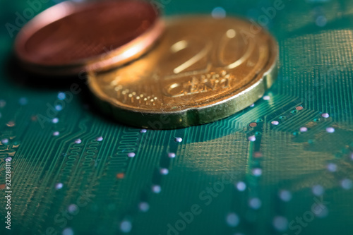 Makro close up of isolated blurred pile euro cent coins on green motherboard