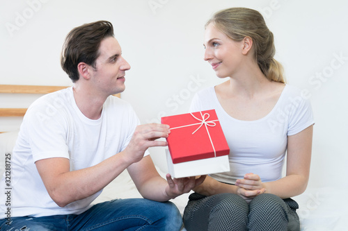 Valentine's day, Couples who celebrate valentines day at home, Lovers give gifts to each other.