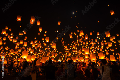 Lanna Dhutanka, Chiang Mai, Thailand - November 11, 2019: People floating lanterns to the sky in Loy Krathong Festival or known as Yi Peng Lantern Festival.