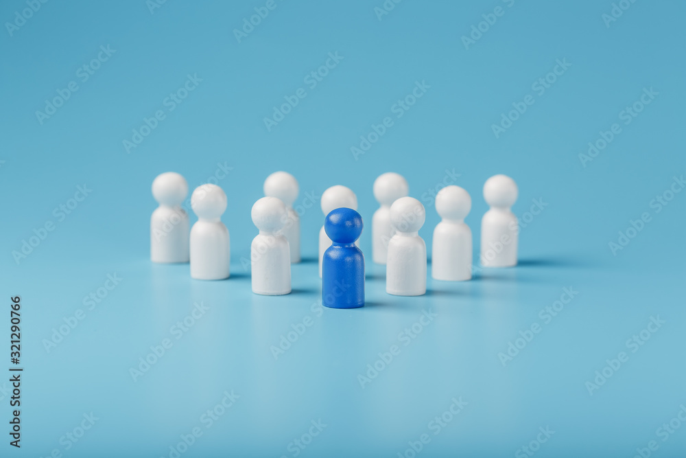 Blue leader the leader leads a group of employees in white to achieve the goal, personnel, and recruitment. The concept of leadership. Blue leader the leader leads a group of employees in white to achieve the goal, personnel, and recruitment. The concept of leadership.