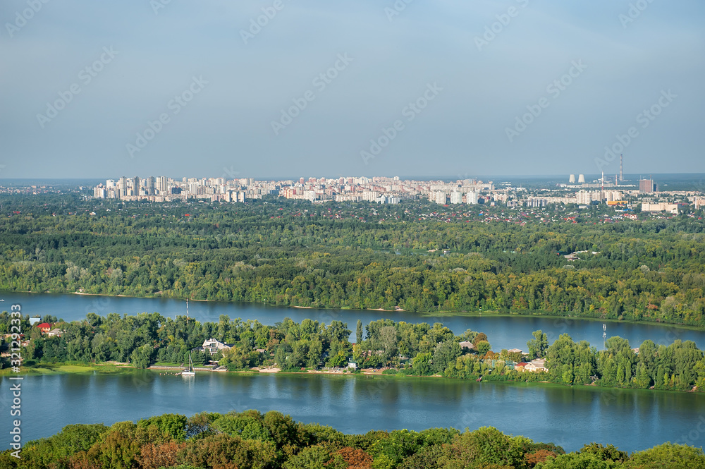 Autumn sunny hot day. Residential areas on hills in Kyiv on the left bank of the Dnieper River. Kyiv. Ukraine.