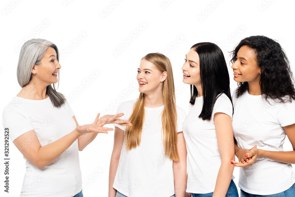 four multicultural women smiling isolated on white four multicultural women smiling isolated on white