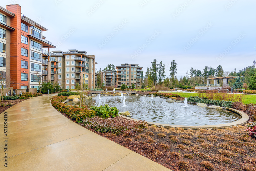 Modern apartment buildings with nice pond in Vancouver, British Columbia, Canada.