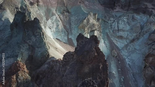 Cinematic Aerial View of Rock Formations in Mountain Range of Aysen Region, Chile photo