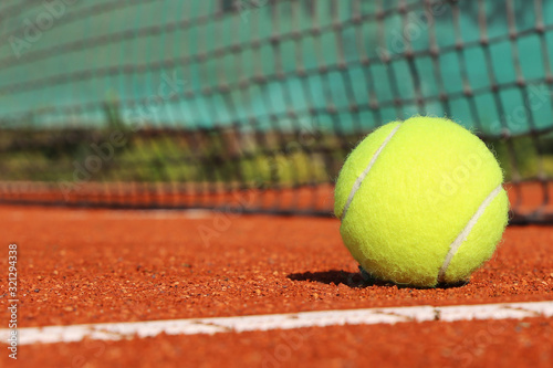 Tennis court with ball and net, close-up © U. J. Alexander