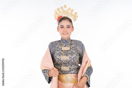 A beautiful Malaysian traditional female dancer wearing traditional dance outfit. Half length portrait isolated in white. Landscape orientation. photo