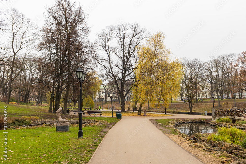 park in Riga with a canal and a bridge