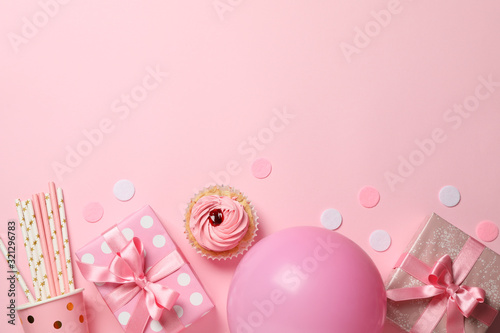 Composition with gift boxes and balloon on pink background, space for text