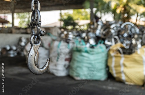 used forklift hook in the recycling industry plant with selective focus.
