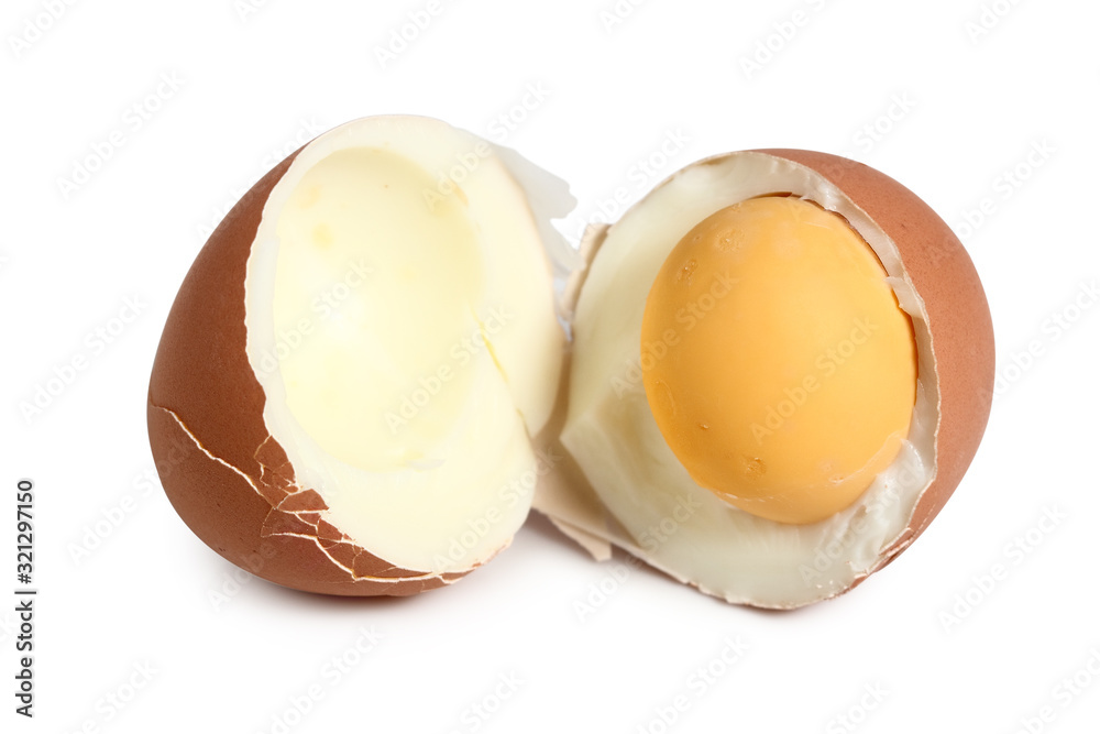 Broken brown hard boiled eggs with shell. Isolated with clipping path. Macro. Broken brown hard boiled eggs with shell. Isolated with clipping path. Macro.