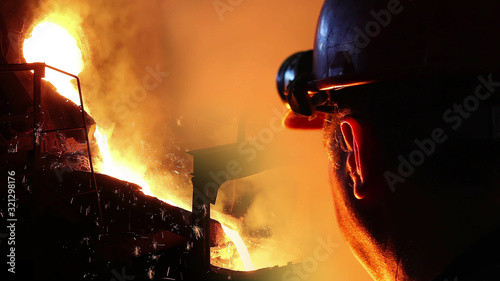 Fotografie Liquid metal in the foundry, melting iron in furnace, steel mill